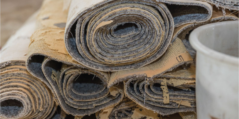 rolls of removed carpet