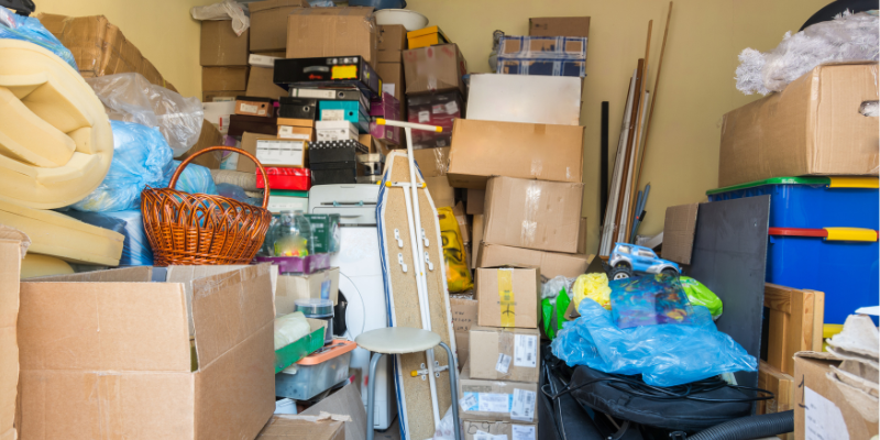 piles of boxes and junk in basement